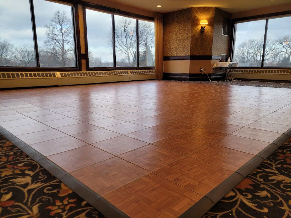 Portable dance floor installed indoors in banquet hall